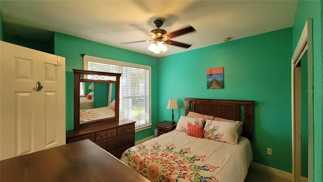 a large kitchen with kitchen island a large counter top space a sink stainless steel appliances and cabinets