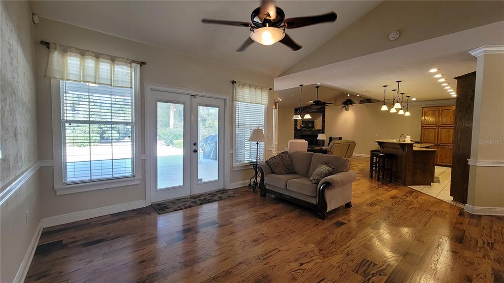 8762 Highway 26 Newberry, FL 32669 - Photo 24 of 63 a living room with furniture and a large window