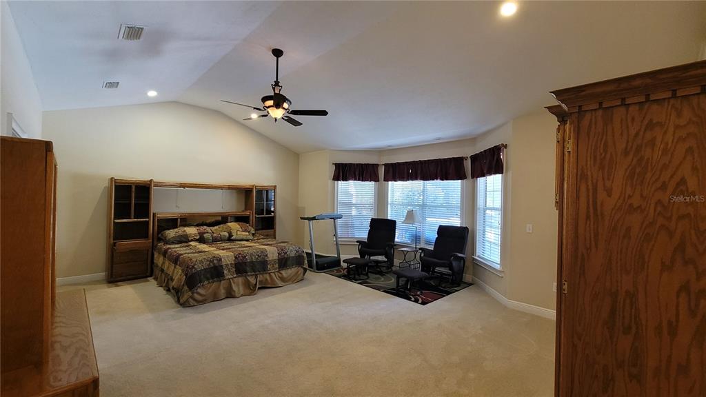 8762 Highway 26 Newberry, FL 32669 - Photo 27 of 63 a living room with furniture a ceiling fan and a window
