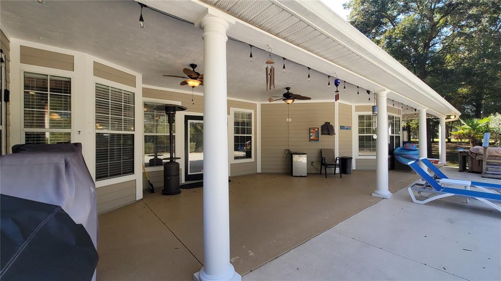 8762 Highway 26 Newberry, FL 32669 - Photo 40 of 63 a view of a patio with table and chairs and a barbeque