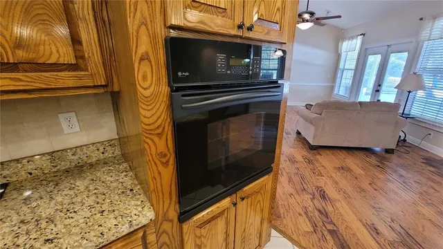 a living room with furniture window and a flat screen tv