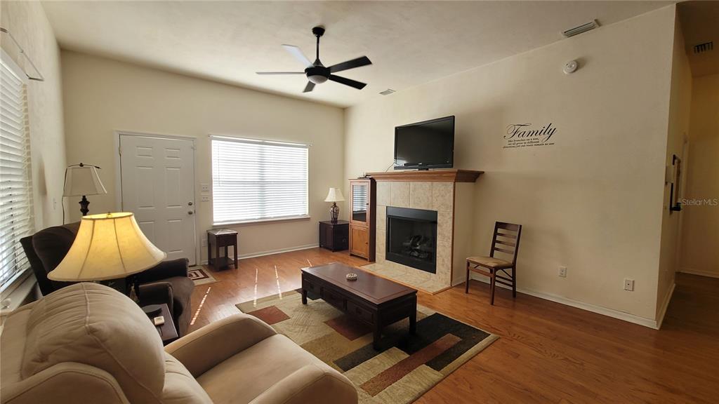 8762 Highway 26 Newberry, FL 32669 - Photo 47 of 63 a living room with furniture and a fireplace