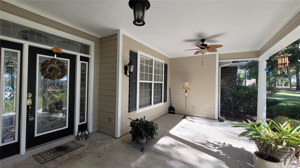 8762 Highway 26 Newberry, FL 32669 - Photo 6 of 63 a bedroom with a bed and a large window with balcony view