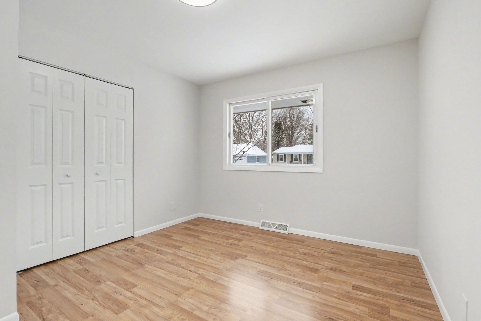 40 Codorus Road Montgomery, IL 60538 - Photo 8 of 15 a view of a bedroom with wooden floor and closet