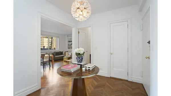 a living room with furniture and a table