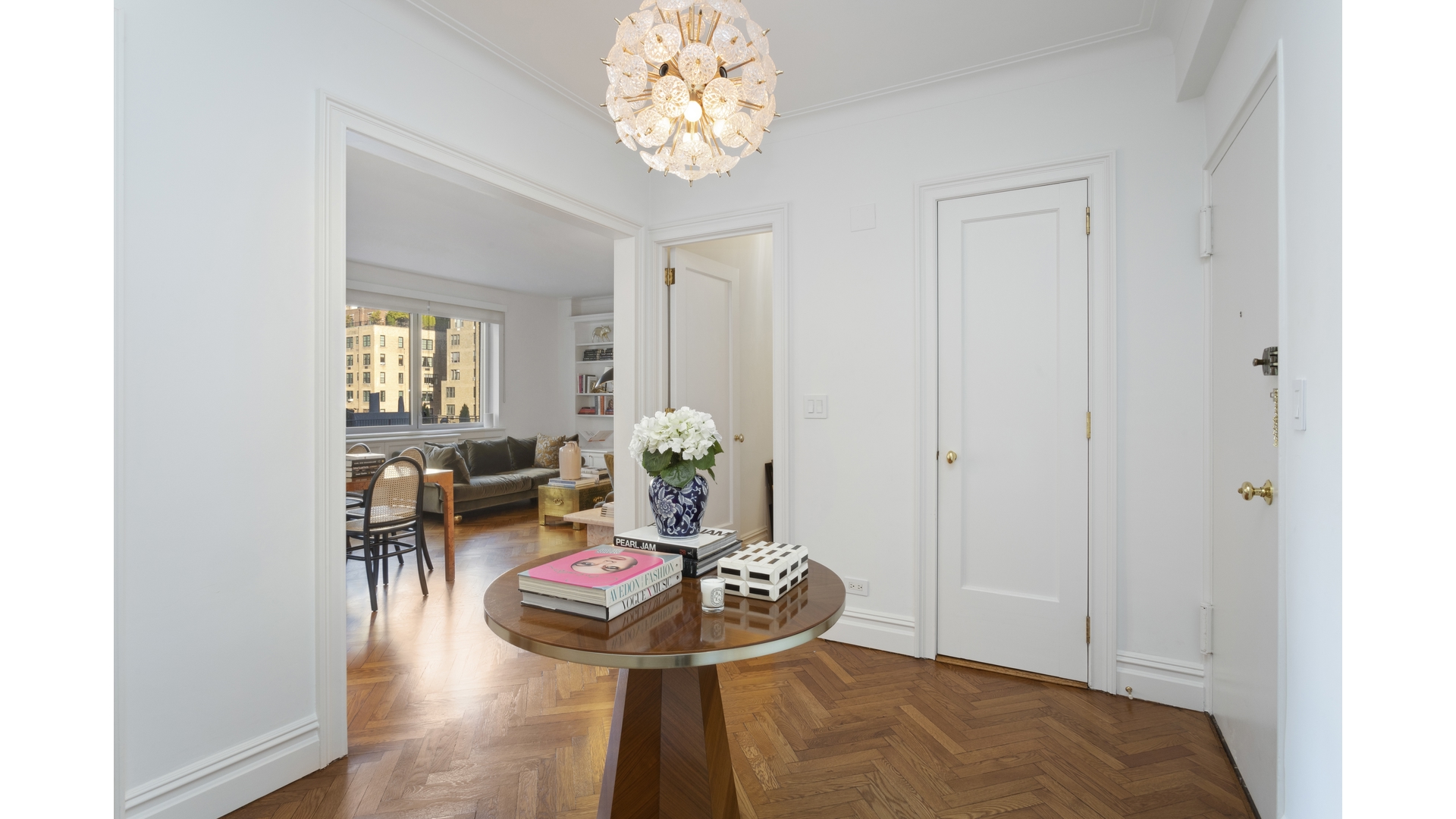 923 5th Avenue, Unit 9G Manhattan, NY 10021 - Photo 6 of 13 a living room with furniture and a table