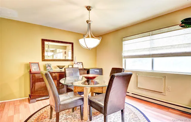 a dining room with furniture and window
