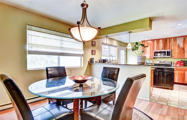 a view of a dining room with furniture window and outside view