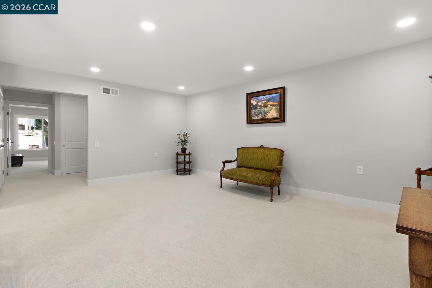 1132 Running Springs Road, Unit 11 Walnut Creek, CA 94595 - Photo 6 of 18 a hallway with a bench and a couch