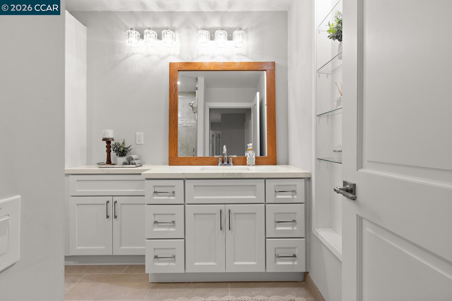 1132 Running Springs Road, Unit 11 Walnut Creek, CA 94595 - Photo 9 of 18 a bathroom with a sink vanity and mirror
