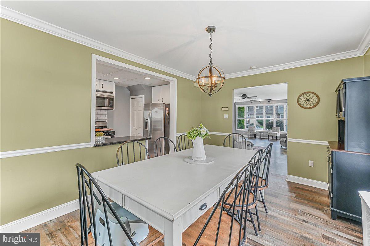 244 Sedgewood Road Springfield, PA 19064 - Photo 12 of 31 a view of a dining room with furniture window and wooden floor