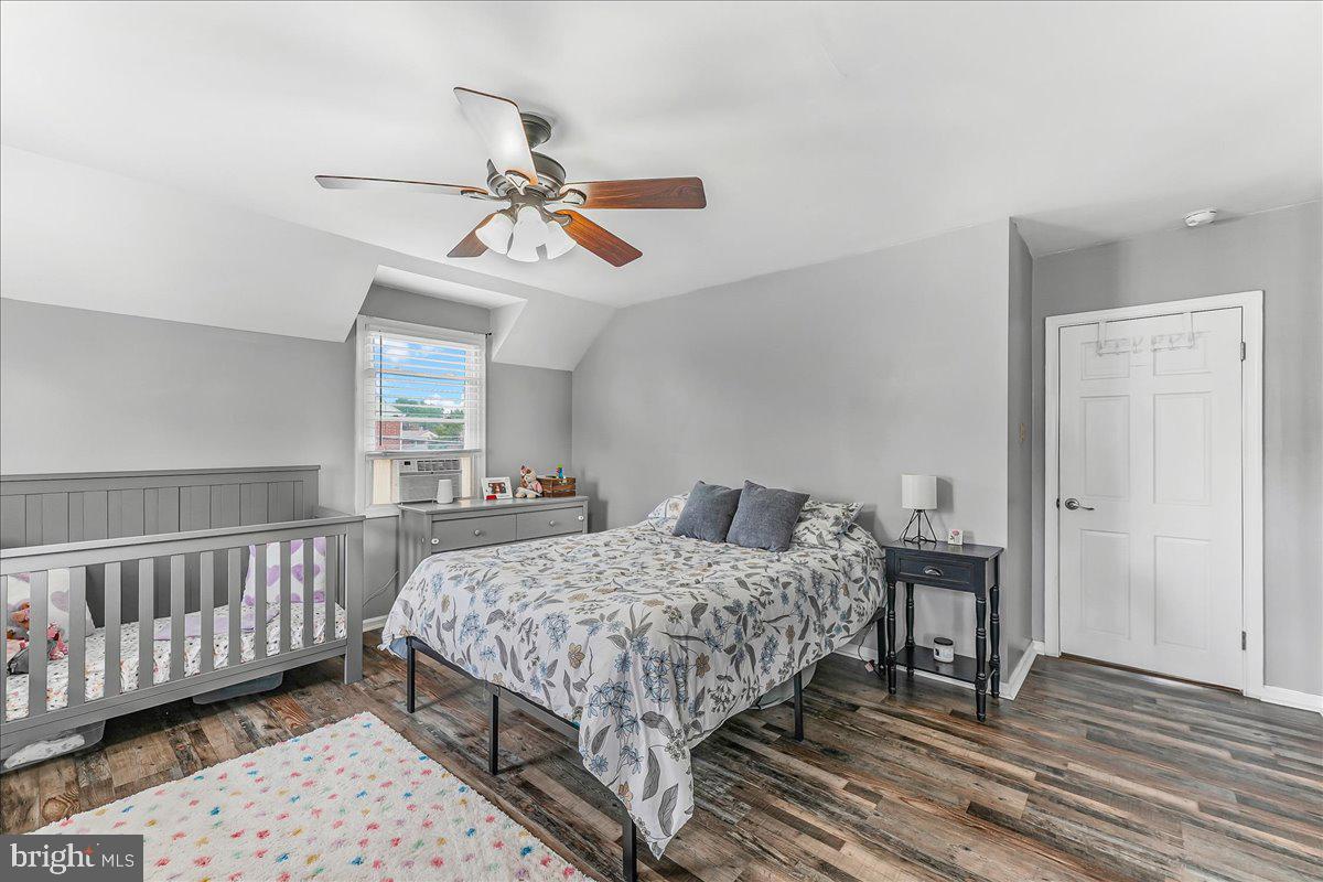 244 Sedgewood Road Springfield, PA 19064 - Photo 18 of 31 a bedroom with a bed and wooden floor