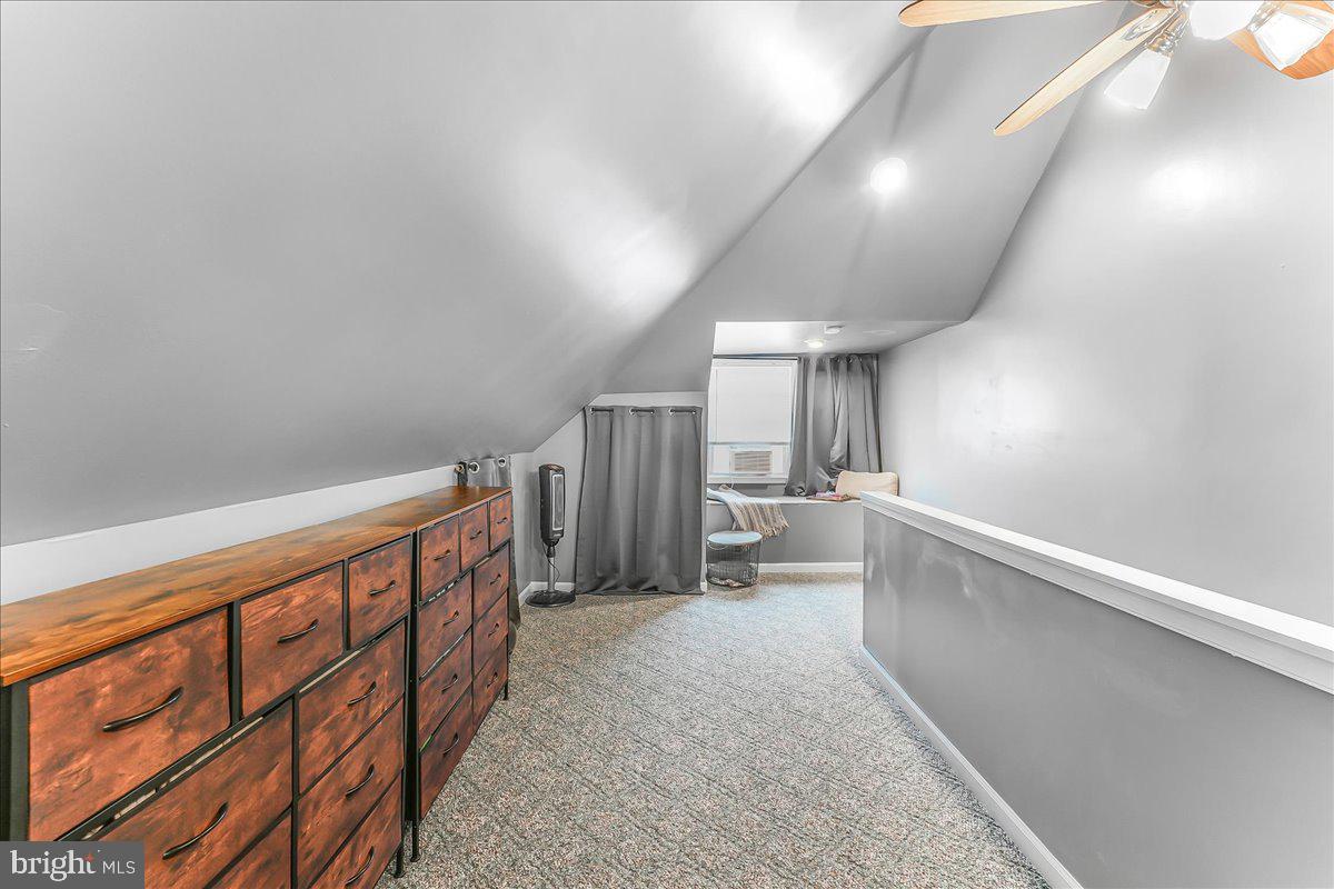 244 Sedgewood Road Springfield, PA 19064 - Photo 25 of 31 a view of a hallway with stairs and furniture