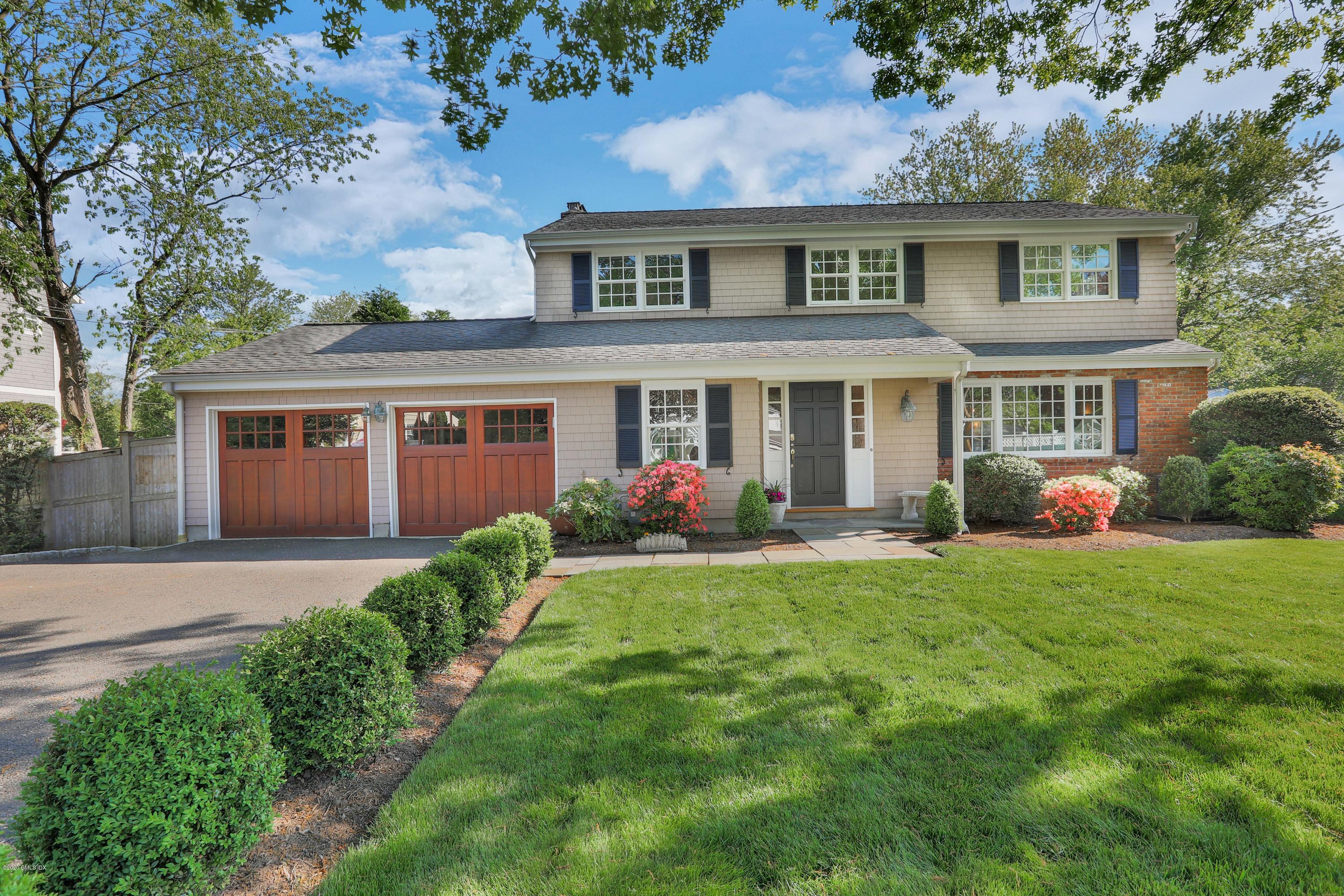 38 Split Timber Place Riverside, CT 06878 - Photo 1 of 24 front view of a house with a yard