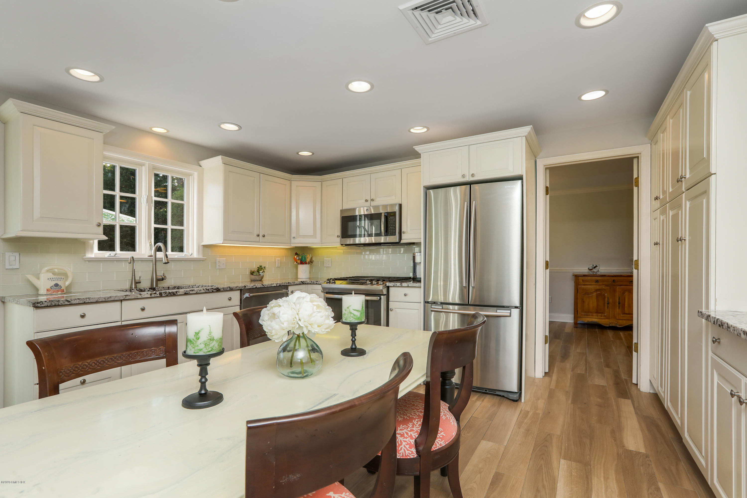 38 Split Timber Place Riverside, CT 06878 - Photo 6 of 24 a kitchen with refrigerator and chairs