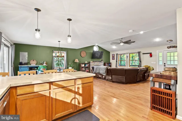 a view of a kitchen and dining room