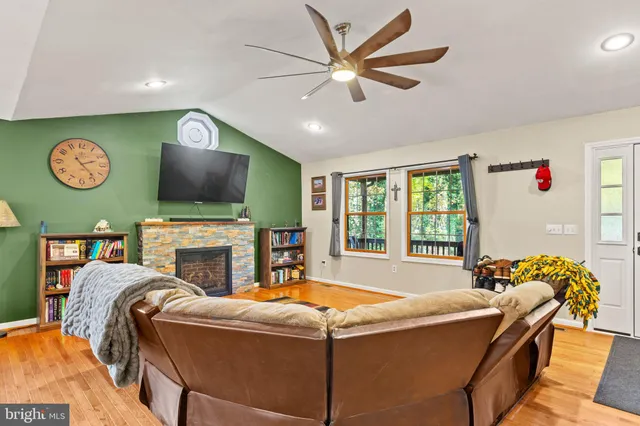 a living room with fireplace furniture and a flat screen tv