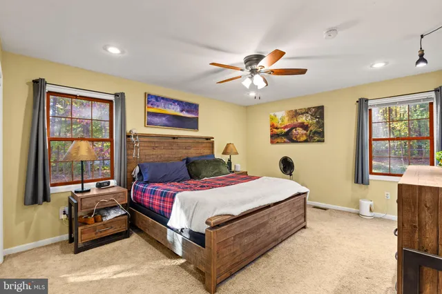 a bedroom with a bed and a couch