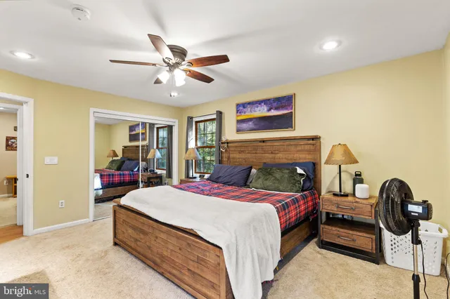 a bedroom with a bed and dresser