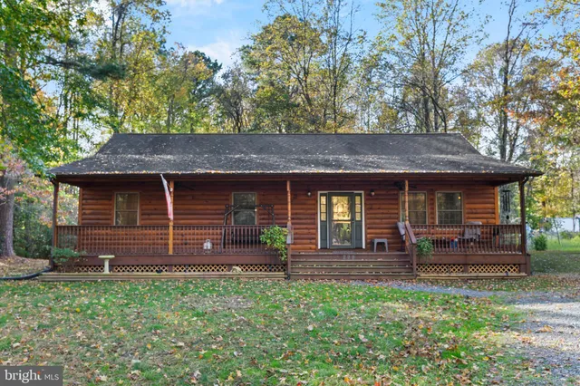 front view of a house with a bench