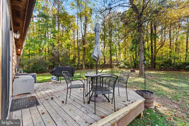 a view of a chairs and table in patio
