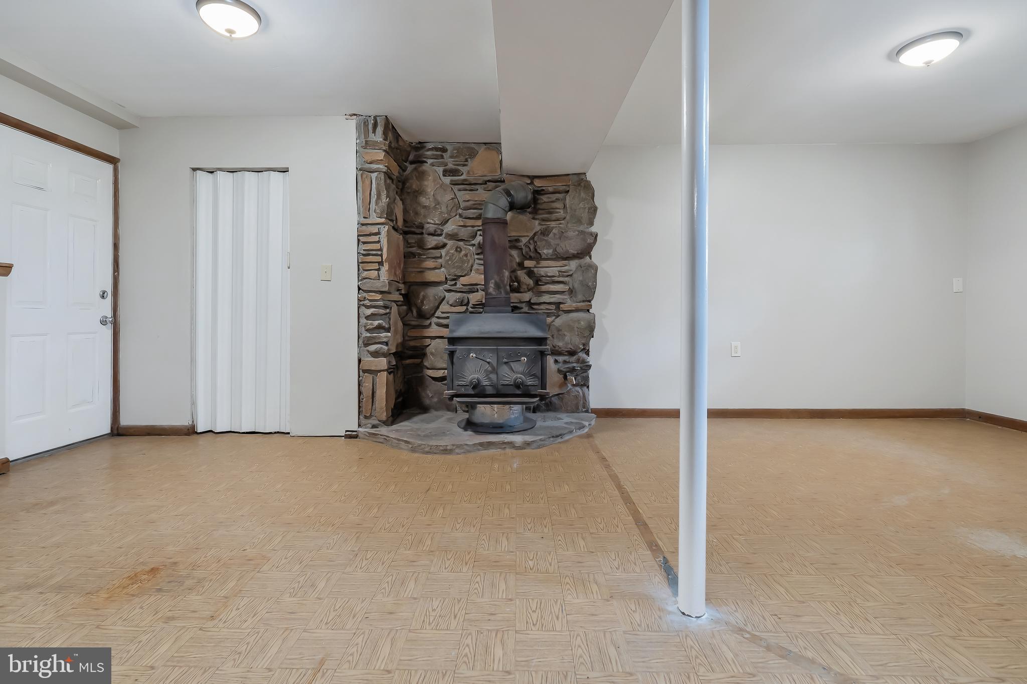 2405 Carrollton Road Finksburg, MD 21048 - Photo 24 of 32 Rock Wall with Wood Burning Stove