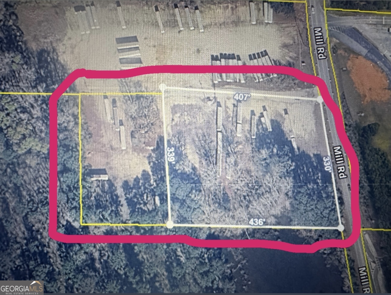 184 Mill Road McDonough, GA 30253 - Photo 27 of 40 a street sign that is sitting on a wooden wall