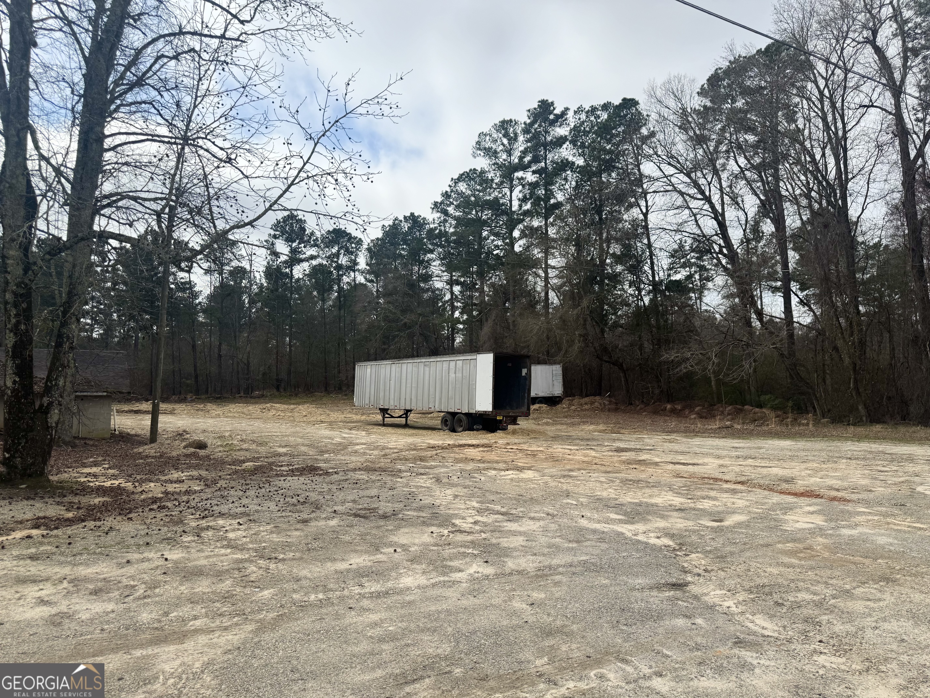 184 Mill Road McDonough, GA 30253 - Photo 8 of 40 a house with trees in front of it