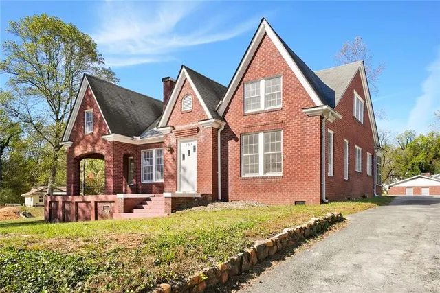 a front view of a house with a yard