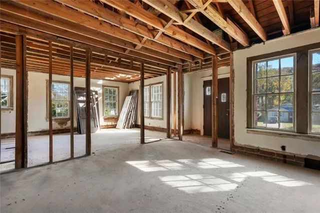 a view of an empty room with a balcony