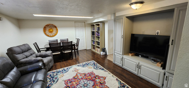 574 West Harding Avenue Cedar City, UT 84720 - Photo 18 of 43 Living room a textured ceiling and dark wood-type flooring