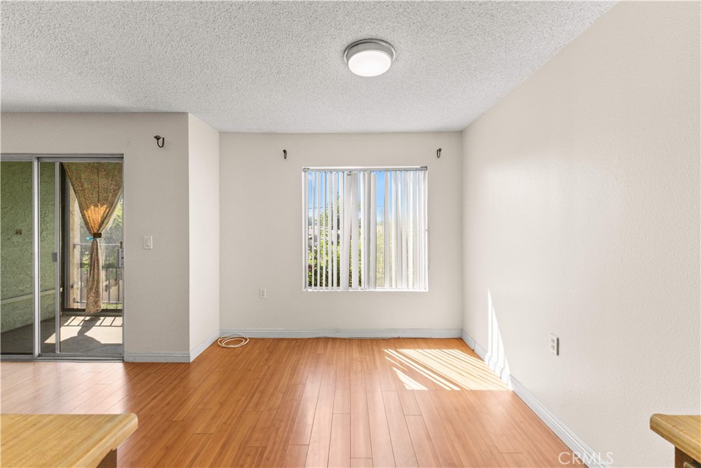 4501 Peck Road, Unit 76 El Monte, CA 91732 - Photo 15 of 35 an empty room with wooden floor and windows