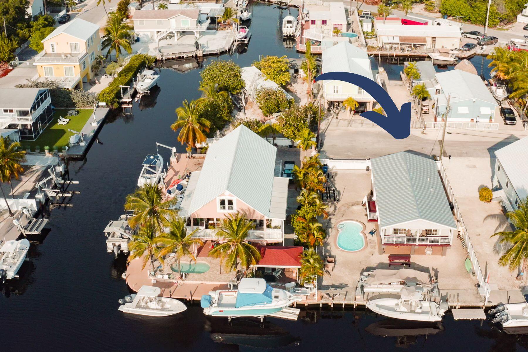 338 Windley Road Key Largo, FL 33037 - Photo 1 of 40 front MLS with arrow