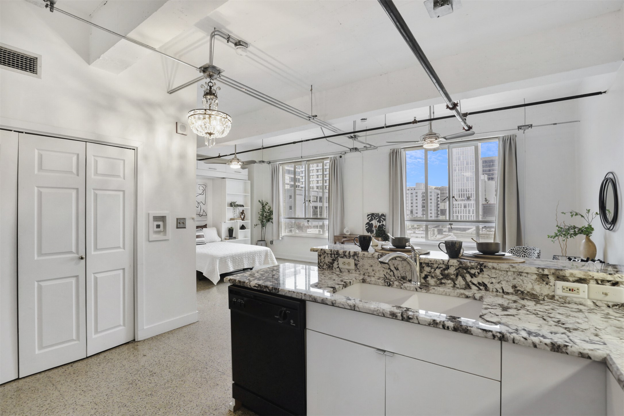 710 Colorado Street, Unit 4G Austin, TX 78701 - Photo 11 of 39 a kitchen with sink refrigerator and window
