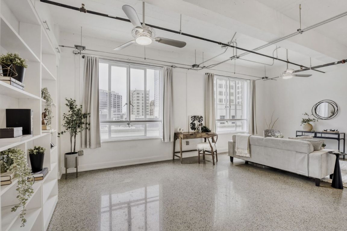 710 Colorado Street, Unit 4G Austin, TX 78701 - Photo 14 of 39 With the bed up during the day, you have excellent flexibility for use of the bonus space, with room for an office desk between the living area & bedroom.