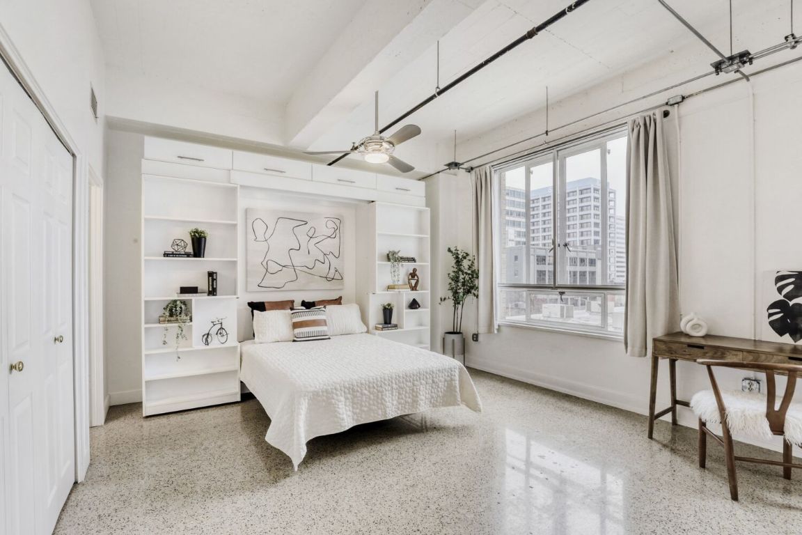 710 Colorado Street, Unit 4G Austin, TX 78701 - Photo 15 of 39 The built-ins surrounding the bed are perfect for storage and showcasing your collectibles.