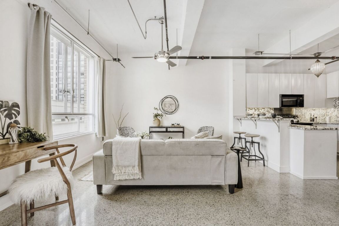 710 Colorado Street, Unit 4G Austin, TX 78701 - Photo 4 of 39 This beautifully updated studio blends modern comfort with preserved character, including the original 1938 terrazzo flooring.