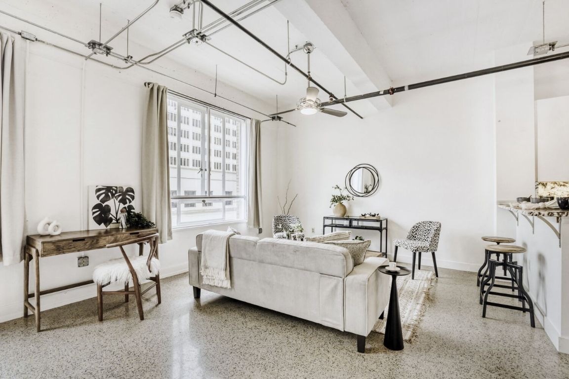 710 Colorado Street, Unit 4G Austin, TX 78701 - Photo 7 of 39 Modern ceiling fans blends seamlessly with the overall aesthetic and keep the air flowing throughout the condo.