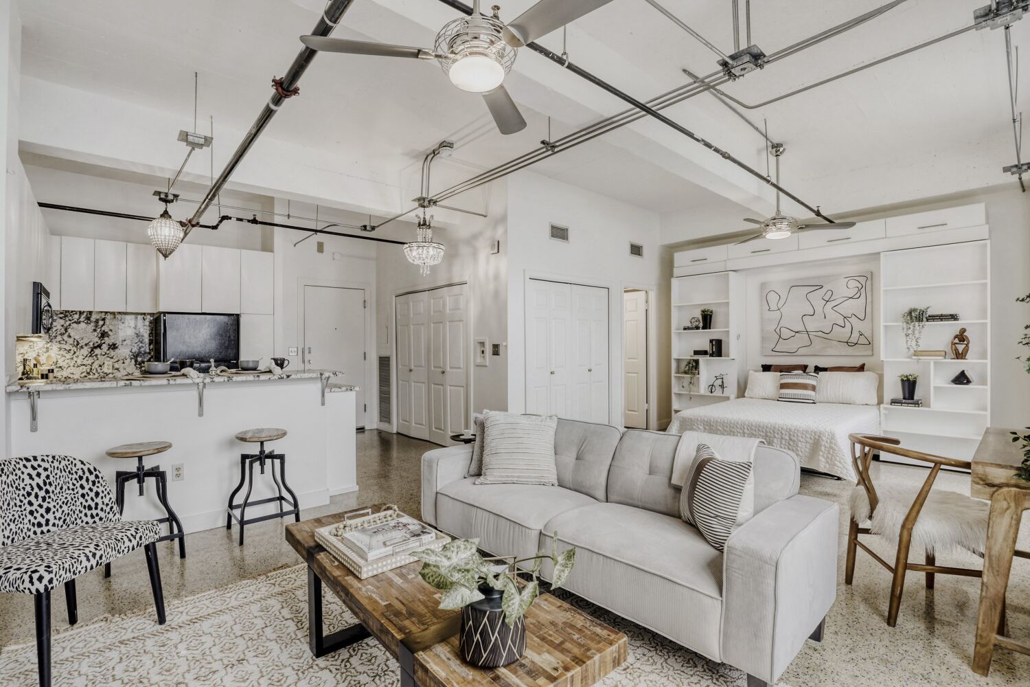 710 Colorado Street, Unit 4G Austin, TX 78701 - Photo 38 of 39 a living room with furniture and a chandelier
