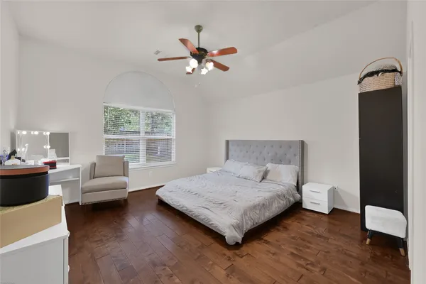 a bedroom with a bed and a couch