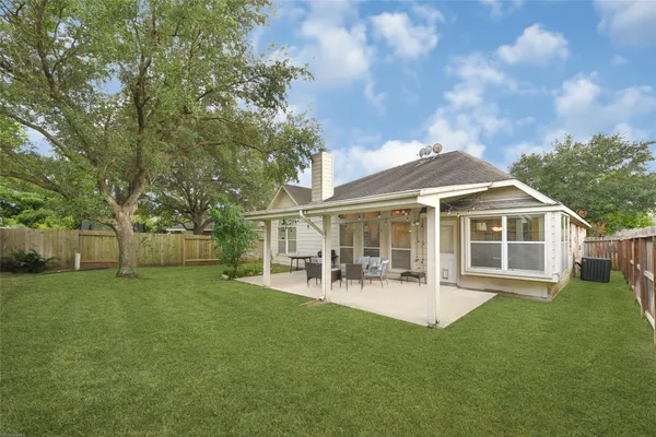 a view of a house with a yard porch and sitting area
