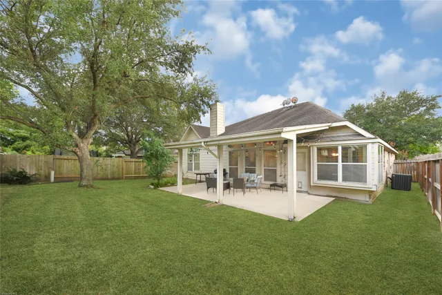 a view of a house with a yard porch and sitting area