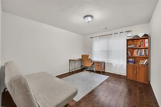 a room with furniture and a book shelf