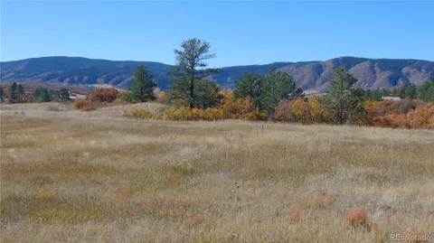 a view of a town with mountains in the background