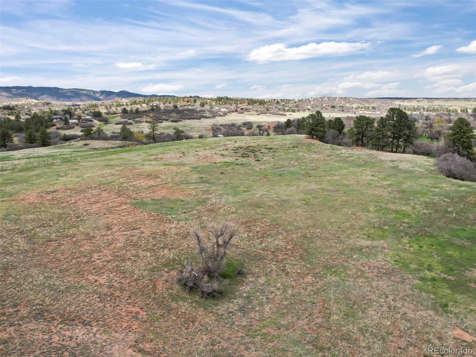 4771 Jackson Creek Road Sedalia, CO 80135 - Photo 12 of 19 a view of a field with an ocean