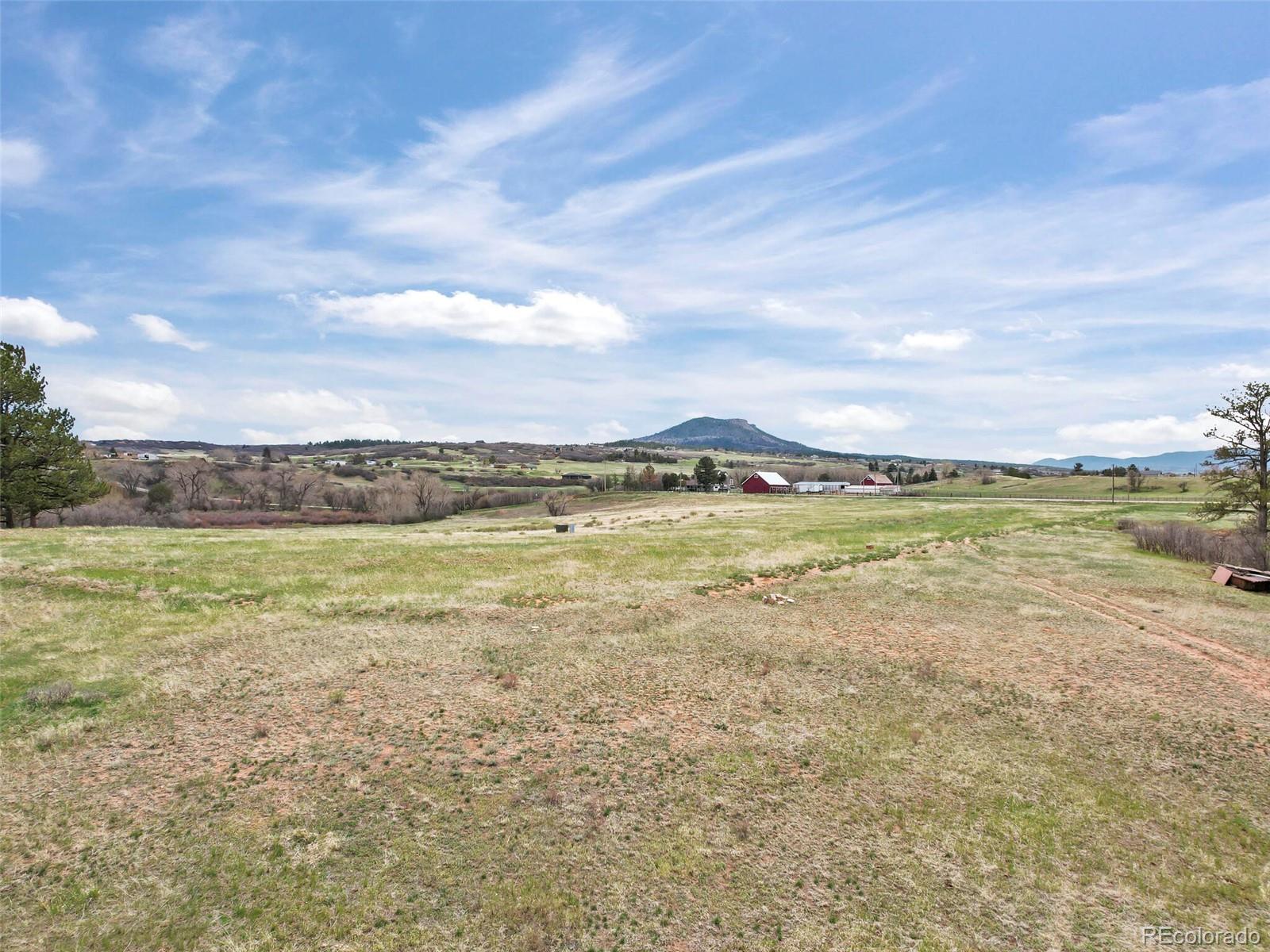 4771 Jackson Creek Road Sedalia, CO 80135 - Photo 16 of 19 a view of an ocean and beach