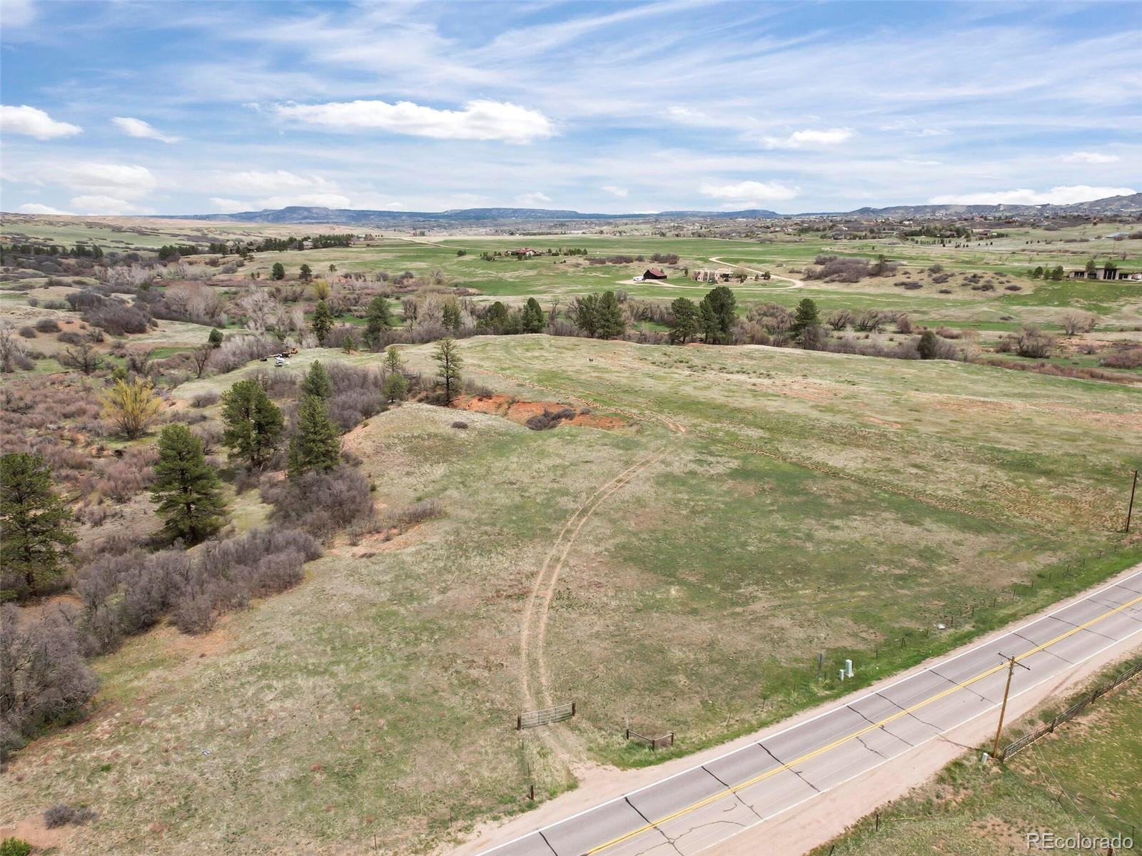 4771 Jackson Creek Road Sedalia, CO 80135 - Photo 5 of 19 a view of a city with an ocean