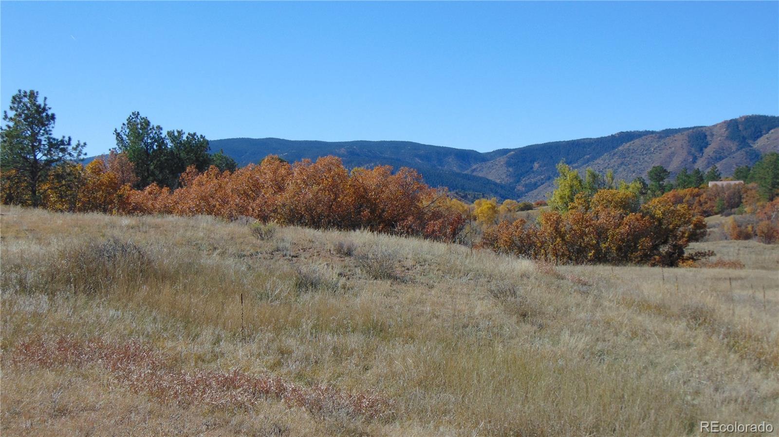 4771 Jackson Creek Road Sedalia, CO 80135 - Photo 8 of 19 a view of mountain and sunset