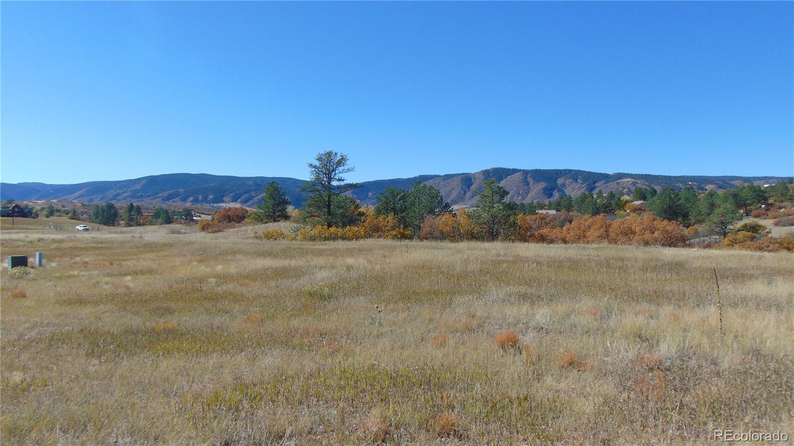 4771 Jackson Creek Road Sedalia, CO 80135 - Photo 10 of 19 a view of lake with mountain