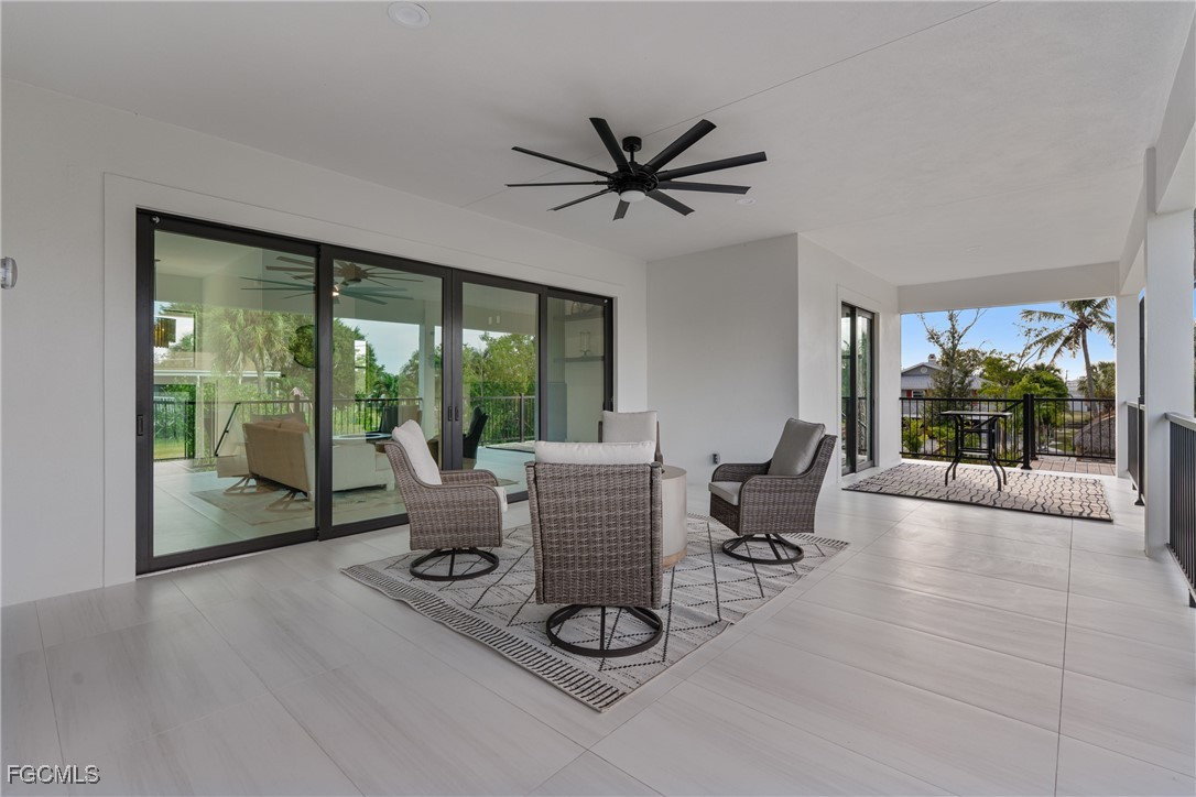 18190 Pioneer Road Fort Myers, FL 33908 - Photo 11 of 45 a living room with furniture and a large window